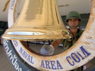 Sailor rings the bell at Third Navy Regional HQ, Cape Panwa