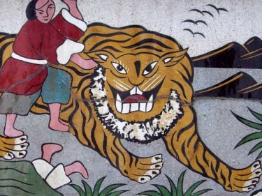 Phuket cemetery frieze: can islanders ride the tiger of inflation?