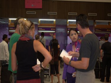 Thai Airways ground staff help stranded tourists at Phuket airport