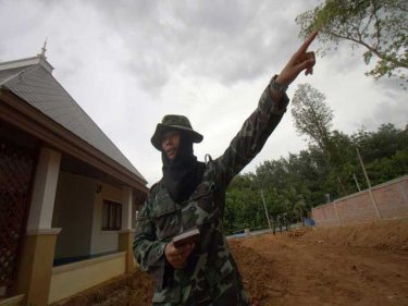 An officer provides directions at the tsunami village site