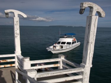 The jetty at Cape Panwa, with Coral Island not far away
