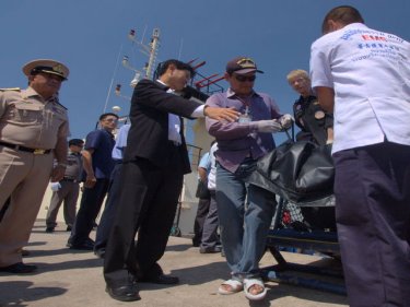 Governor Dr Preecha Ruangjan greets the bodies at Phuket deep sea port