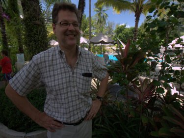 Wolfgang Meusberger, in the garden poolside at Holiday Inn