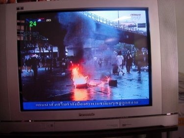 Fire in a Bangkok street on Monday as troops move in