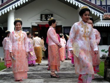 Baba brides at a mass wedding ceremony on Phuket