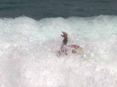 A Monsoon Rider wipes out at Kalim Bay today.