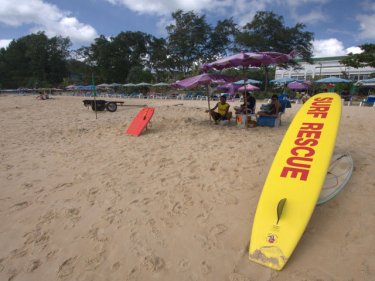 Lifeguards on duty at Karon beach, with a jetski nearby