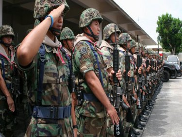 Troops line up at Phuket International Airport this afternoon