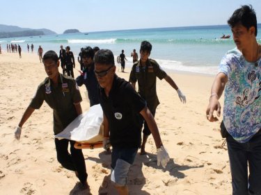 The man's body is carried ashore at Karon beach