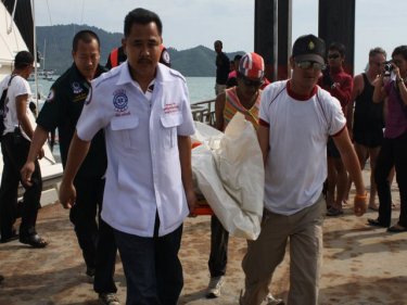 The body of the sailing tragedy victim is carried ashore on Phuket