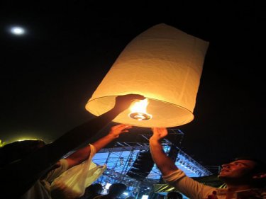 Phuket revellers reach for the sky on Patong beach last night in 2009