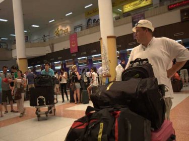 Moving again at Phuket airport, a planeload of Australia-bound passengers