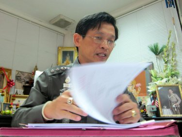 Patong's Colonel Grissak Songmoonnark at his Kathu police station desk