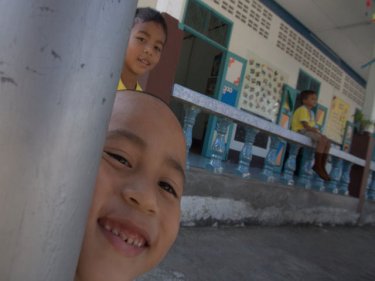 Children play at a school for just 14 pupils. Koh Lon's pace is different to Phuket