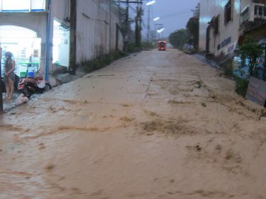 Another day, another downpour . . . this Patong road becomes a river