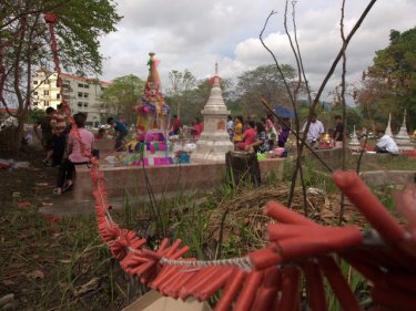 Phuket families gather at Rang Hill in Phuket City to pay their respects