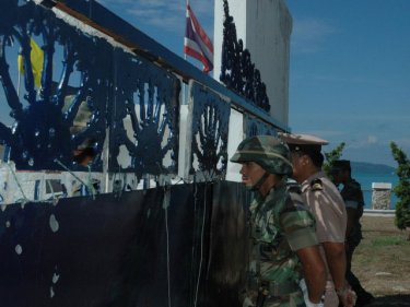 A navy officer at Phuket's Cape Panwa base prepares to accept a protest letter