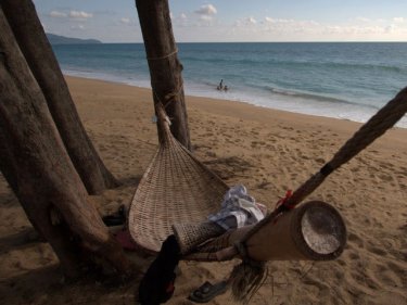A hammock in the shade: Local boys take advantage of Phuket at its best