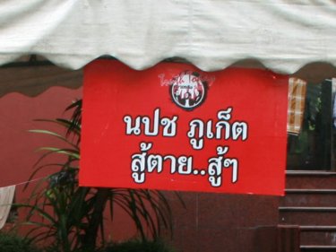 ''Phuket Red to the end'' says this sign from the Bangkok red compound