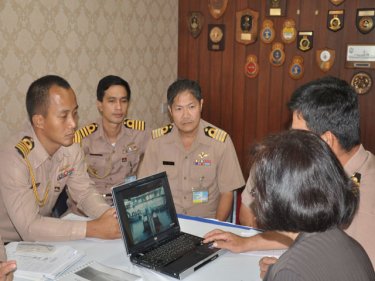 On Phuket, Navy officers plan the interception and recovery of the buoy