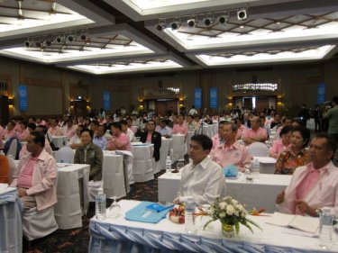 The PM sits among other MPs at the Phuket weekend conference