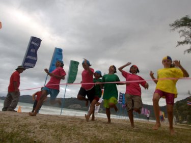Children enjoy a sprint race at a Phuket surf lifesaving carnival