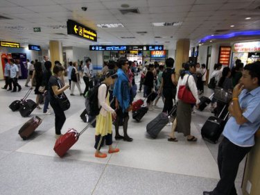Passengers at Phuket airport this week: the high season holds high hopes