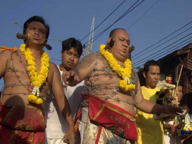 Phuket's possessed warriors crisscross Phuket City in daily parades