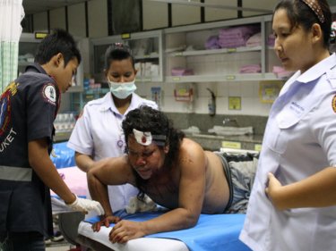 Sarawoot Suttikan, 36, being treated at a Phuket hospital after the battle