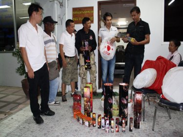 Patong police admire the crackers belonging to Malee Sudprasert