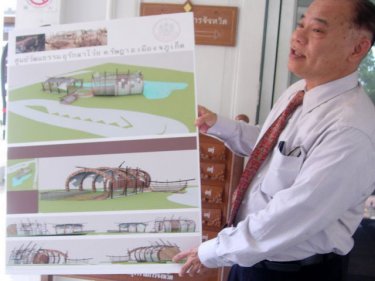 A Public Works official shows off the traditional design of the museum