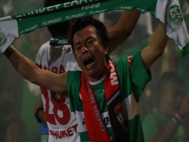 A fan in the crowd at Surakul Stadium appreciates Phuket's win