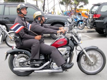 Police riders join a parade in Patong aimed at safer motorcycling