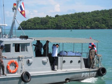 The body of the captain of a tanker is carried to Phuket today