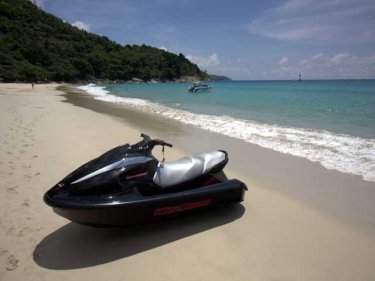 Unwelcome but tolerated, a jet-ski on the sand at Relax Bay