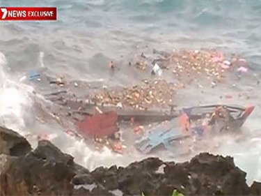 Television footage of the boat smashed on rocks off Christmas Island