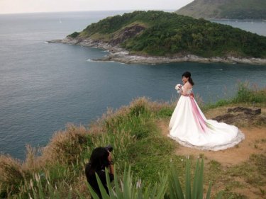 A bride from China with a backdrop of a million Phuket waves