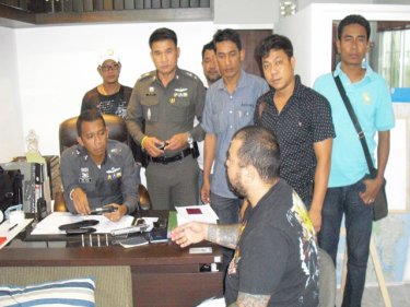 John Lee explains his actions to police at the Kathu station in Patong