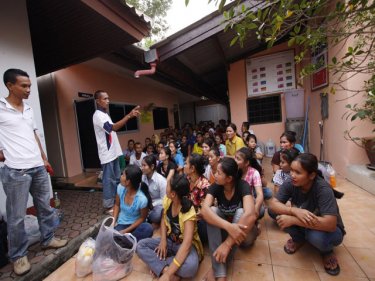 Cambodian detainees assemble at Phuket Immigration's jail area in late 2010