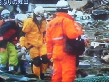 Searchers among wreckage in Japan, where one disaster followed another