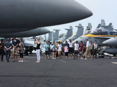 Visitors enjoy the flight deck on USS Ronald Reagan yesterday
