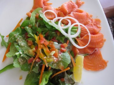 A salmon salad, tending to healthy compared to the tasty pastries