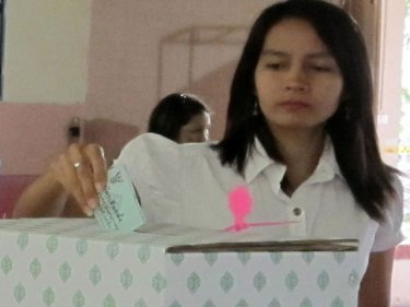 A Phuket voter casts her ballot: others say they have missed out