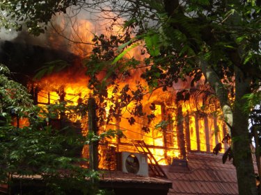 Fire consumes the home at Chalong in southern Phuket today