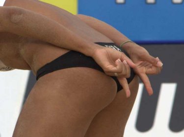 Secret hand signals indicate team strategy in beach volleyball