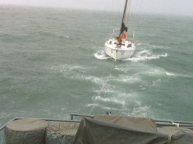 The yacht is towed in after the Royal Thai Navy rescue this morning