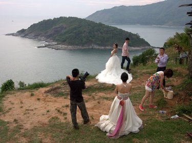 Posing at the Phuket Prom: Couples have their wedding photos taken