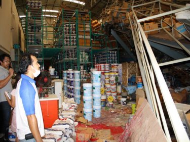 A Phuket landslip hits a warehouse wall and shakes the goods inside