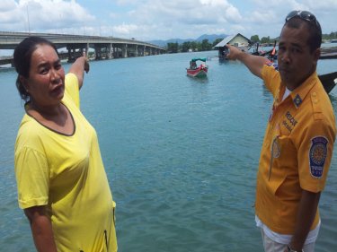 Locals point to the spot on Thepkasattri Bridge where the car was parked