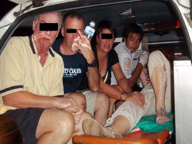 Charity workers tend to the tourists who had an altercation in Patong